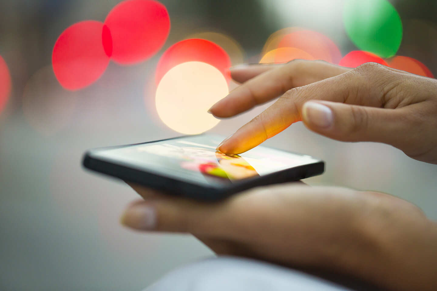 woman touching smartphone haptics